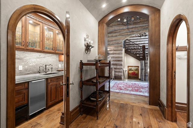 1943 N Wolf Creek Ranch Rd Unit 12, Heber City, UT 84032 - wine cellar with light wood-style floors, arched walkways, rustic walls, and recessed lighting
