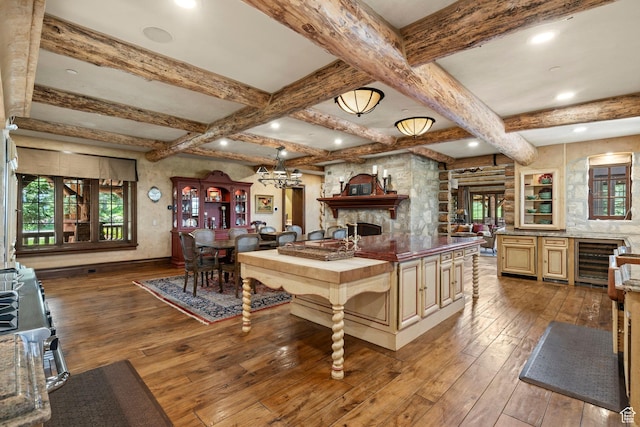 1943 N Wolf Creek Ranch Rd Unit 12, Heber City, UT 84032 - kitchen featuring wine cooler, hardwood / wood-style flooring, healthy amount of natural light, open floor plan, and beam ceiling