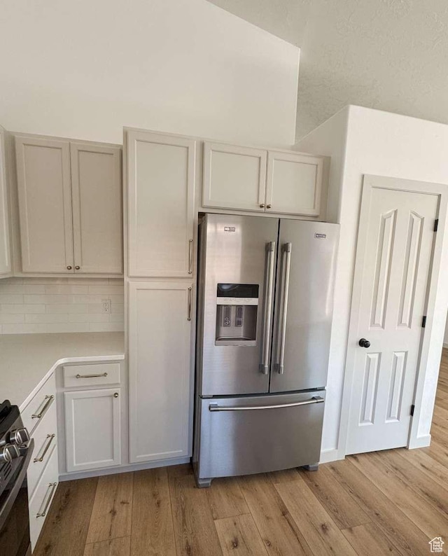 319 E 710 S, Ivins, UT 84738 - kitchen featuring high end refrigerator, gas range, light wood finished floors, and light countertops
