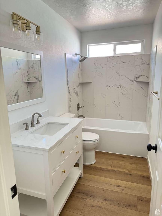 319 E 710 S, Ivins, UT 84738 - full bath featuring vanity, plenty of natural light, hardwood / wood-style flooring, bathtub / shower combination, and a textured ceiling