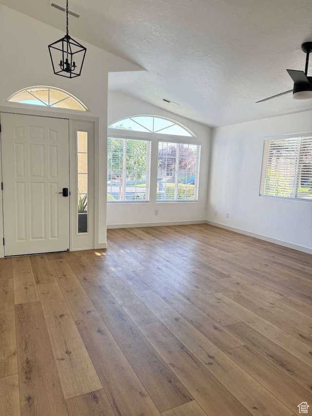 319 E 710 S, Ivins, UT 84738 - entryway featuring light wood-style flooring, healthy amount of natural light, a chandelier, vaulted ceiling, and a ceiling fan