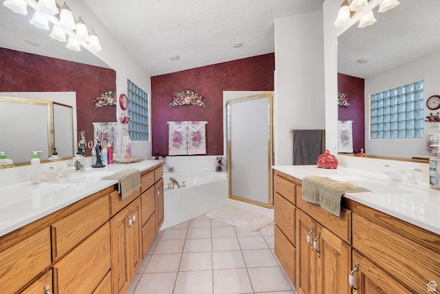 3430 Red Butte Dr, Santa Clara, UT 84765 - bathroom with a stall shower, vanity, a bath, a textured ceiling, and tile patterned floors