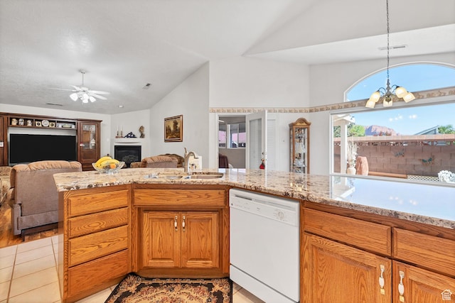 3430 Red Butte Dr, Santa Clara, UT 84765 - kitchen featuring dishwasher, vaulted ceiling, open floor plan, ceiling fan, and a glass covered fireplace