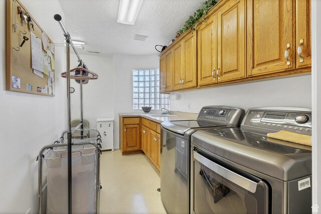 3430 Red Butte Dr, Santa Clara, UT 84765 - laundry room featuring washer and dryer, cabinet space, and a textured ceiling