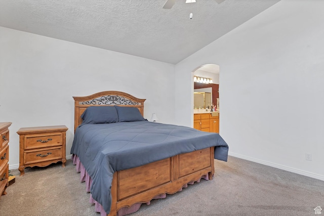 3430 Red Butte Dr, Santa Clara, UT 84765 - bedroom featuring light colored carpet, arched walkways, a textured ceiling, connected bathroom, and a ceiling fan
