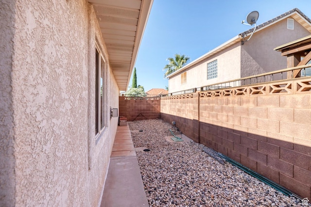 3430 Red Butte Dr, Santa Clara, UT 84765 - view of property exterior featuring stucco siding and a fenced backyard