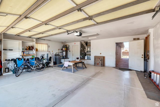 3430 Red Butte Dr, Santa Clara, UT 84765 - garage with water heater and a garage door opener