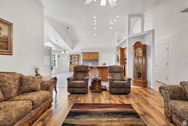 3430 Red Butte Dr, Santa Clara, UT 84765 - living area with ceiling fan, high vaulted ceiling, light wood-style floors, and recessed lighting