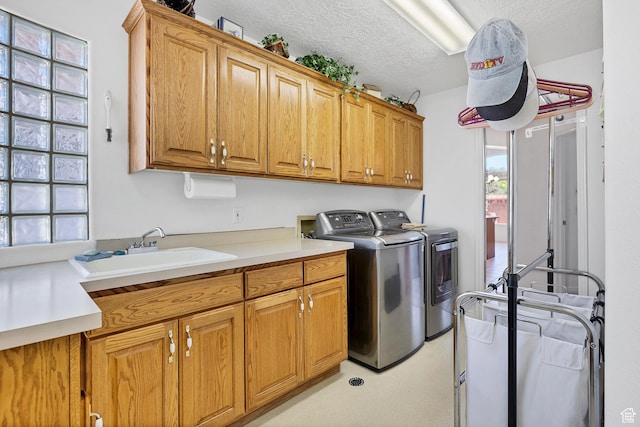 3430 Red Butte Dr, Santa Clara, UT 84765 - laundry room with cabinet space, washer and dryer, and a textured ceiling
