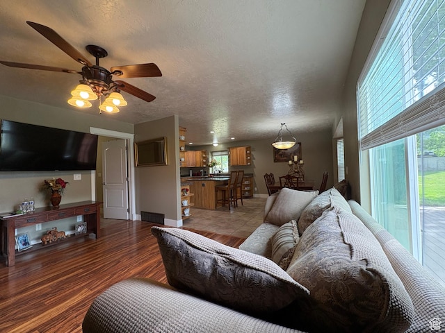 332 W Hillside S, Saratoga Springs, UT 84045 - living area with ceiling fan, light wood-style flooring, and a textured ceiling