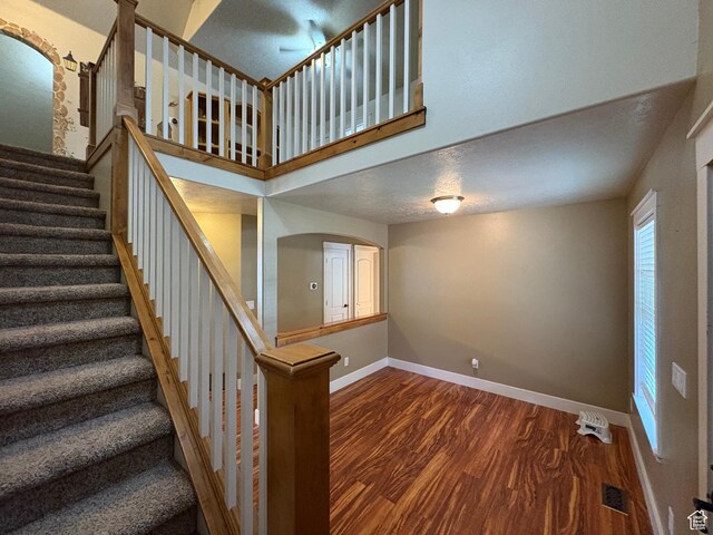 332 W Hillside S, Saratoga Springs, UT 84045 - staircase featuring wood finished floors and a towering ceiling