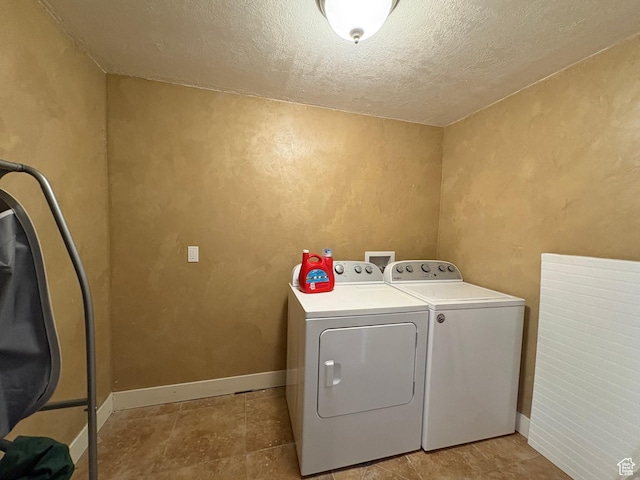 332 W Hillside S, Saratoga Springs, UT 84045 - laundry room featuring washing machine and clothes dryer and a textured ceiling