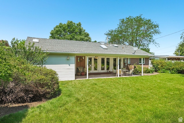 4199 S Monarch Way, Salt Lake City, UT 84124 - back of property with french doors, a patio, and a lawn