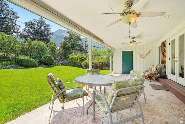 4199 S Monarch Way, Salt Lake City, UT 84124 - view of patio / terrace featuring french doors, outdoor dining space, a mountain view, and a ceiling fan