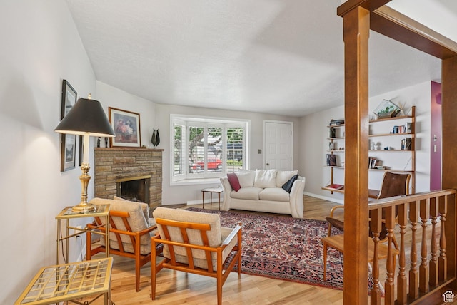 4199 S Monarch Way, Salt Lake City, UT 84124 - living area with wood finished floors and a stone fireplace