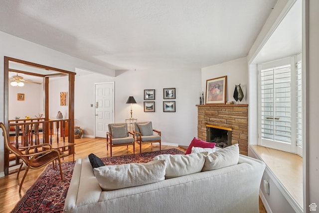 4199 S Monarch Way, Salt Lake City, UT 84124 - living area featuring wood finished floors and a stone fireplace