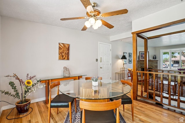 4199 S Monarch Way, Salt Lake City, UT 84124 - dining room with a textured ceiling, light wood-style floors, and a ceiling fan