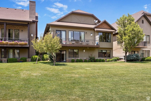 14599 S Chaumont Ct, Draper, UT 84020 - rear view of property featuring a lawn, stucco siding, a chimney, and a balcony