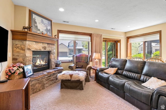 14599 S Chaumont Ct, Draper, UT 84020 - living room featuring carpet flooring, a stone fireplace, recessed lighting, and a textured ceiling