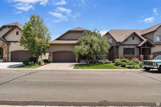 14599 S Chaumont Ct, Draper, UT 84020 - view of front of home featuring stucco siding, driveway, an attached garage, and stone siding