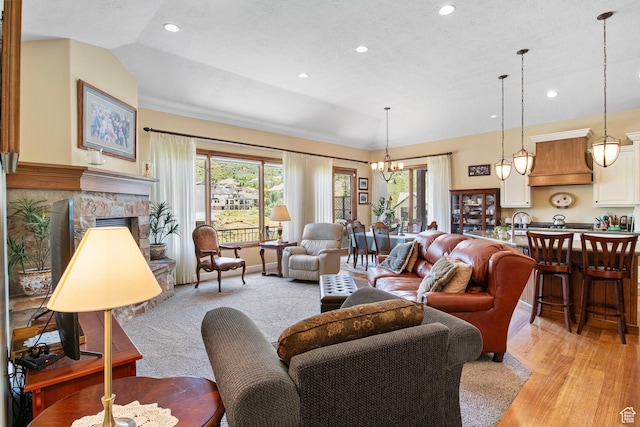 14599 S Chaumont Ct, Draper, UT 84020 - living area featuring a chandelier, plenty of natural light, recessed lighting, lofted ceiling, and light wood-type flooring