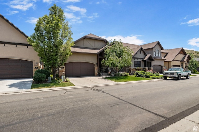 14599 S Chaumont Ct, Draper, UT 84020 - tudor house featuring stucco siding, concrete driveway, and an attached garage