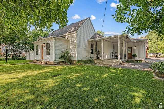 727 S Main St, Mapleton, UT 84664 - view of front of house featuring covered porch, a front yard, and a shingled roof