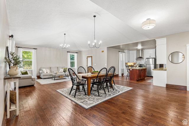 727 S Main St, Mapleton, UT 84664 - dining room with plenty of natural light, a chandelier, dark wood-style floors, vaulted ceiling, and a textured ceiling