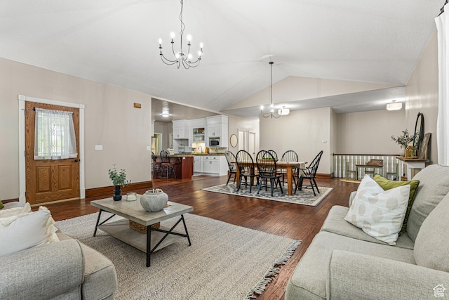 727 S Main St, Mapleton, UT 84664 - living area with a chandelier, vaulted ceiling, and dark wood finished floors