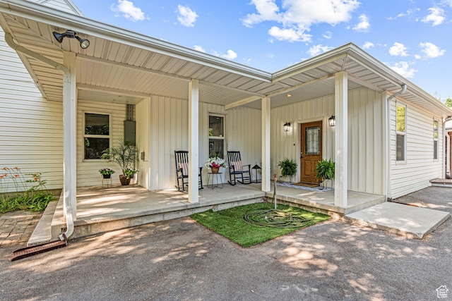 727 S Main St, Mapleton, UT 84664 - doorway to property featuring a porch and board and batten siding