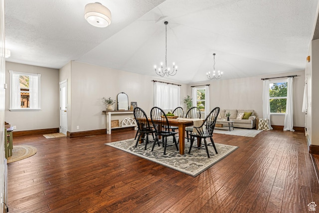727 S Main St, Mapleton, UT 84664 - dining space with a chandelier, plenty of natural light, dark wood-style flooring, vaulted ceiling, and a textured ceiling
