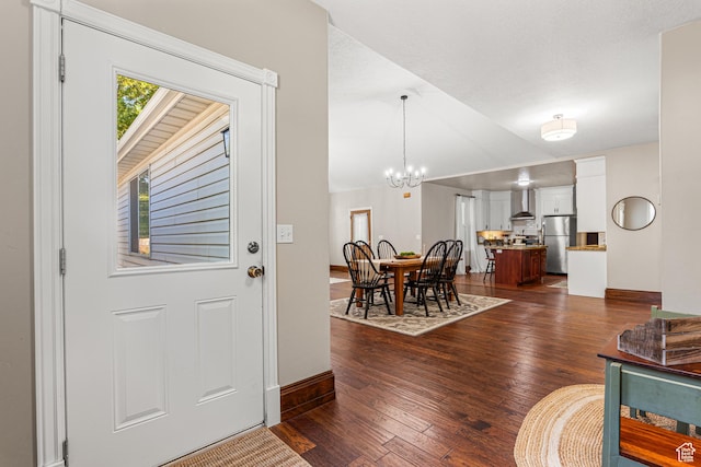 727 S Main St, Mapleton, UT 84664 - foyer entrance featuring dark wood-type flooring, a chandelier, and lofted ceiling