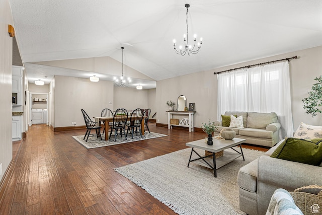 727 S Main St, Mapleton, UT 84664 - living room with washer and dryer, a chandelier, vaulted ceiling, and dark wood-style flooring