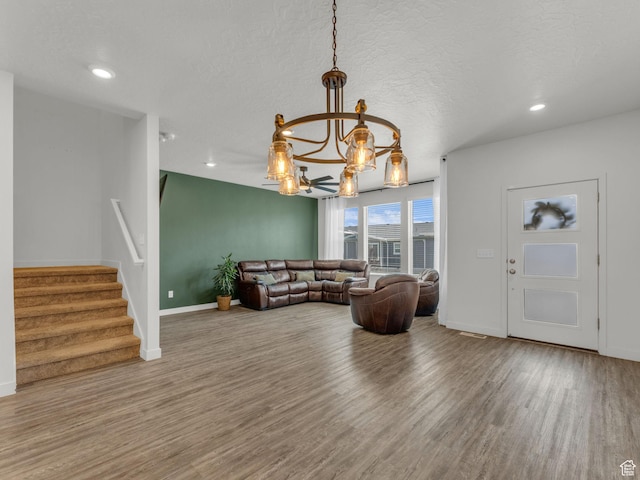 937 W Purpledisk Ct, Saratoga Springs, UT 84045 - living area featuring wood finished floors, a chandelier, stairs, a textured ceiling, and recessed lighting
