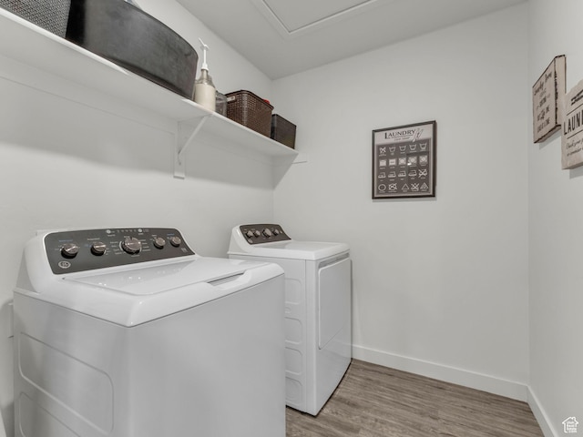 937 W Purpledisk Ct, Saratoga Springs, UT 84045 - laundry area with washing machine and dryer and light wood-style flooring