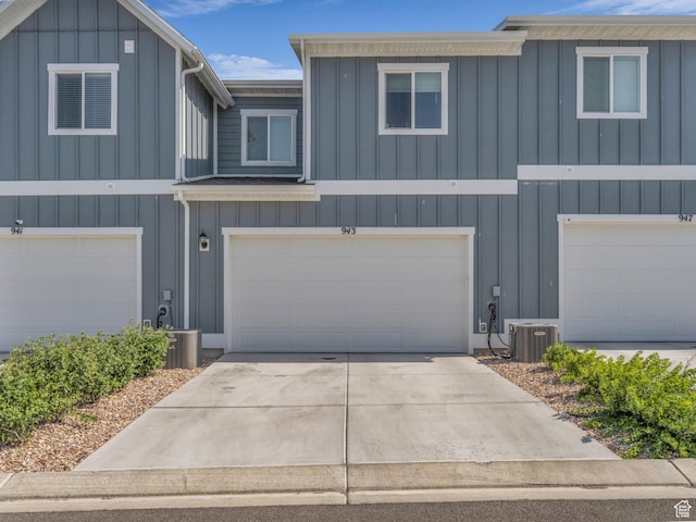 937 W Purpledisk Ct, Saratoga Springs, UT 84045 - view of front of home with board and batten siding, a garage, and concrete driveway
