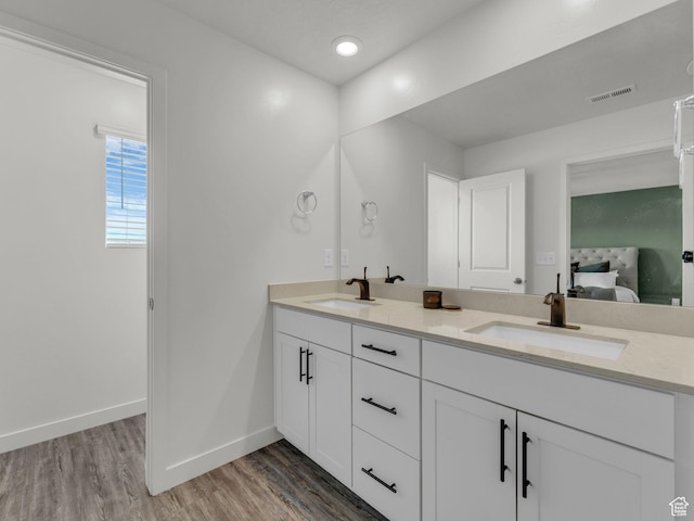 937 W Purpledisk Ct, Saratoga Springs, UT 84045 - bathroom with double vanity, wood finished floors, and ensuite bathroom