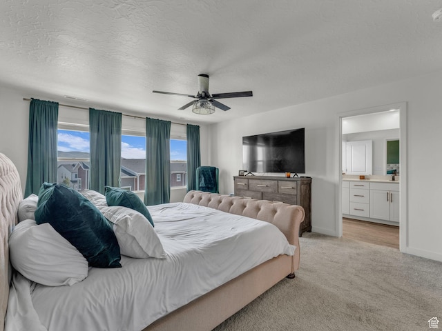 937 W Purpledisk Ct, Saratoga Springs, UT 84045 - bedroom featuring a textured ceiling, light colored carpet, ensuite bathroom, and a ceiling fan