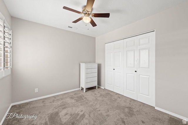 1360 E Telegraph St Unit 18, Washington, UT 84780 - unfurnished bedroom with carpet floors, a closet, a ceiling fan, and multiple windows