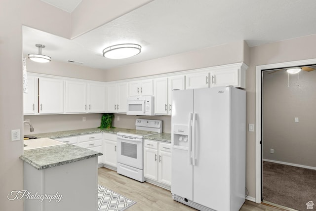 1360 E Telegraph St Unit 18, Washington, UT 84780 - kitchen with white appliances, white cabinetry, and light countertops