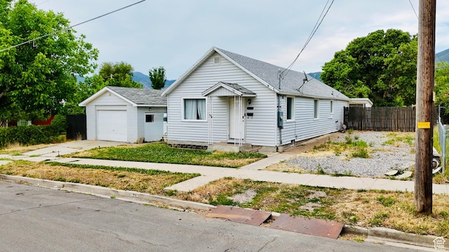 78 N N 3rd St N, Tooele, UT 84074 - view of front facade with concrete driveway, a garage, and a shingled roof