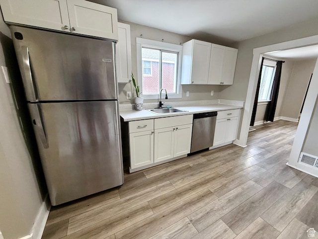 78 N N 3rd St N, Tooele, UT 84074 - kitchen featuring appliances with stainless steel finishes, light countertops, and white cabinetry