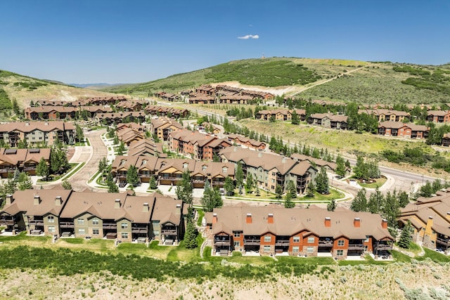 1161 W Wintercress Trl W Unit 27F, Kamas, UT 84036 - aerial view of property's location with nearby suburban area and a mountainous background