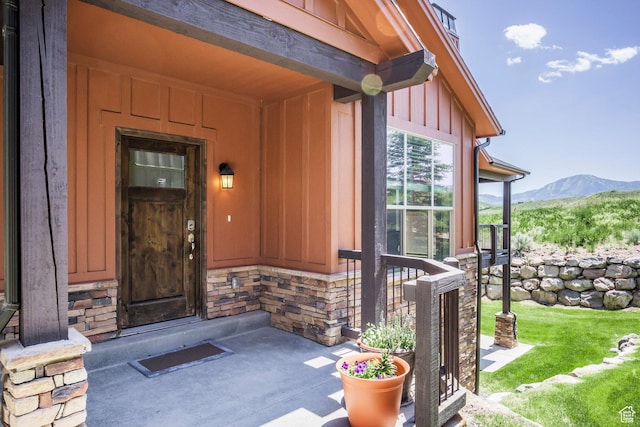 1161 W Wintercress Trl W Unit 27F, Kamas, UT 84036 - property entrance featuring board and batten siding, a mountain view, stone siding, and a porch