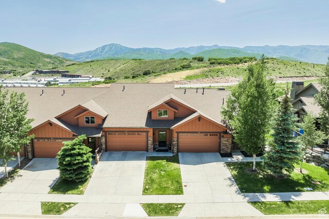 1161 W Wintercress Trl W Unit 27F, Kamas, UT 84036 - view of front of property featuring stone siding, a mountain view, and a garage
