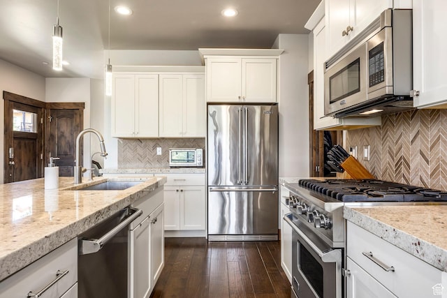 1161 W Wintercress Trl W Unit 27F, Kamas, UT 84036 - kitchen featuring high quality appliances, tasteful backsplash, recessed lighting, and white cabinets