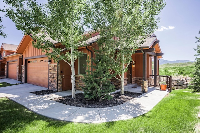 1161 W Wintercress Trl W Unit 27F, Kamas, UT 84036 - view of front facade with stone siding, board and batten siding, an attached garage, and a front lawn