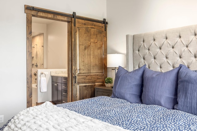 1161 W Wintercress Trl W Unit 27F, Kamas, UT 84036 - bedroom featuring a barn door and ensuite bathroom