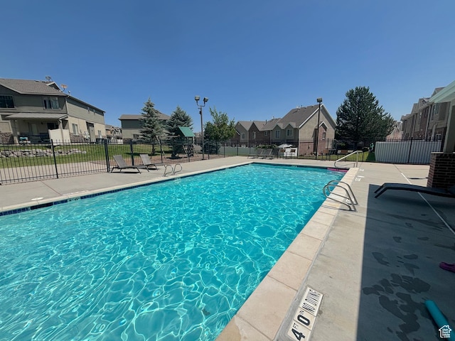 10521 S Sage Flats Way S, Jordan, UT 84009 - community pool featuring a residential view and a patio