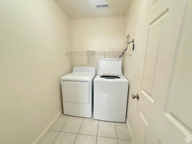 10521 S Sage Flats Way S, Jordan, UT 84009 - laundry area with independent washer and dryer and light tile patterned floors